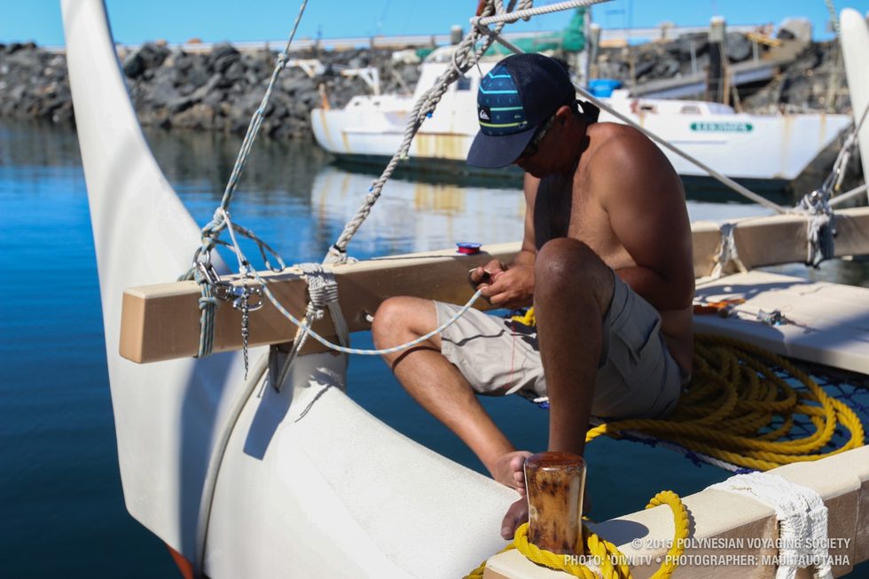 Kawika whipping line on the bow.