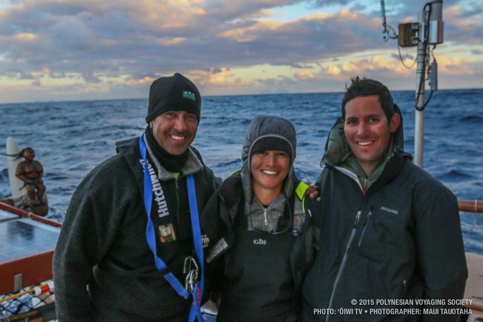 Kawika, Ana, and Kaleo posing in front of Lord Howe island in the background.