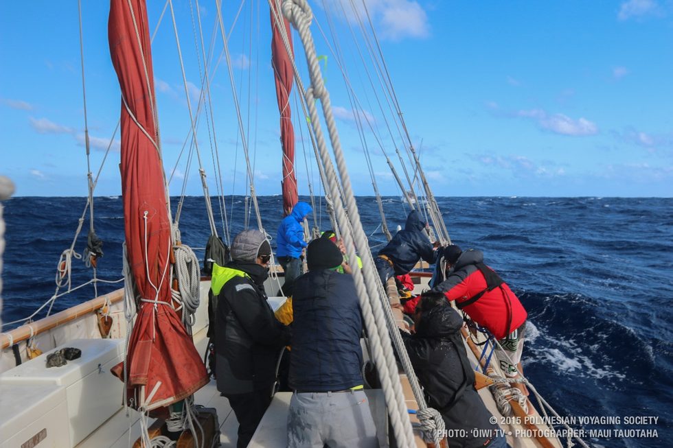 Crew preparing standing rigging to drop the front rig and change out the sail.