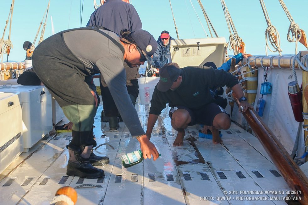 Scrubbing the deck before arrival in Coffs Harbour.