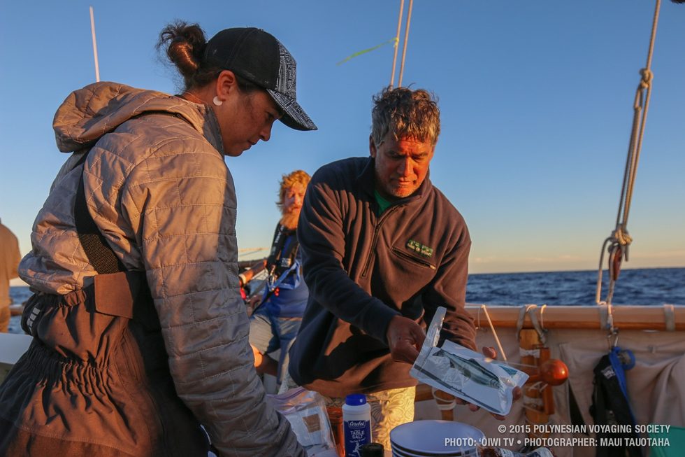 Captain Bruce Blankenfeld getting some salmon to put on his orzo dinner.