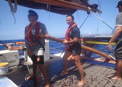 Safety Officer Darienne Dey and dedicated student Maleko Lorenzo steer Hikianalia through rough seas.