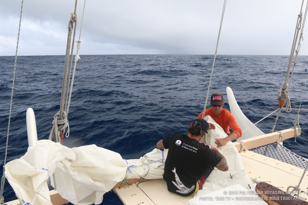 Kai and Kaleo setting up the jib beore the squall on the horizon hits.