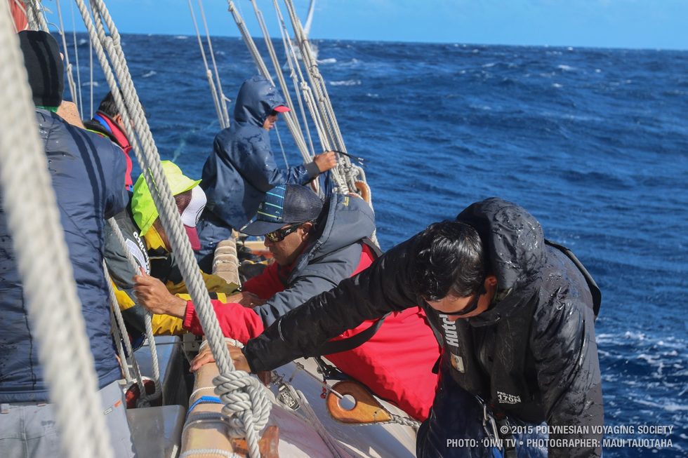 Crew preparing standing rigging to drop the front rig and change out the sail.