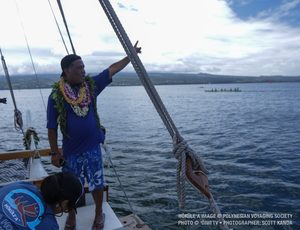 Kālepa waves as Hōkūleʻa departs Hilo. 