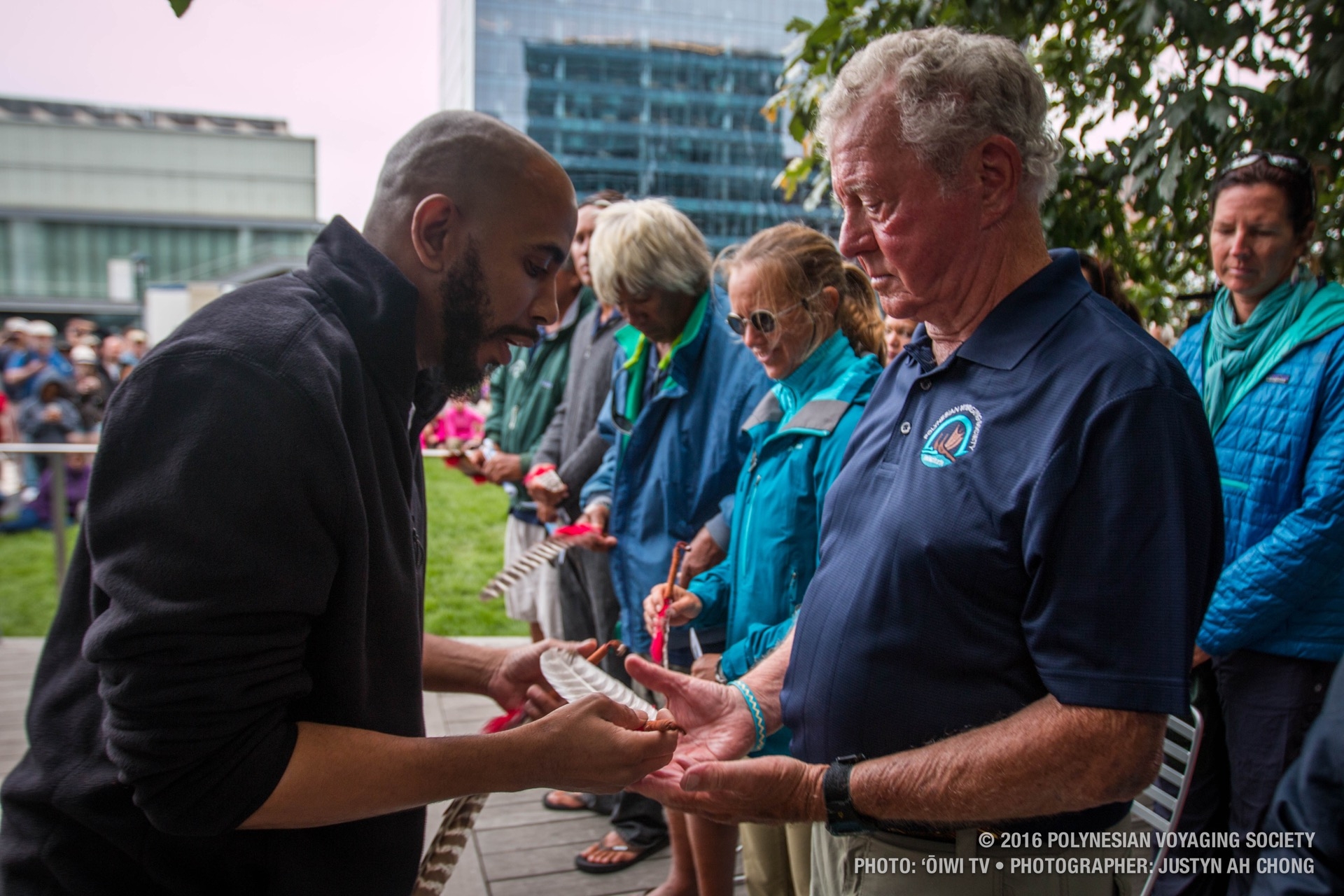 Massachusett Tribal member, Strong Medicine, gifts the crew decorated Turkey feathers as a symbol of the relationship formed here today.
