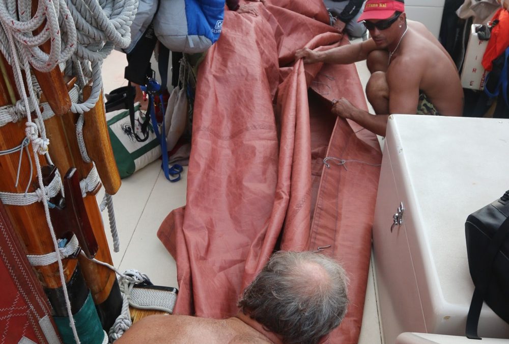 Folding the crab claw sail.
