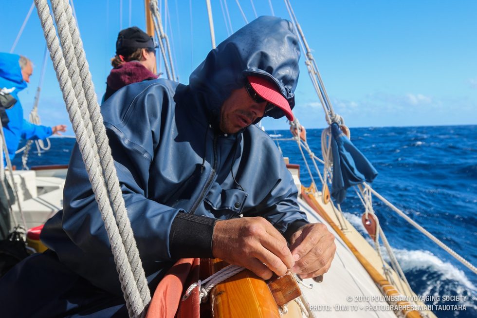 Duane taking off sail ties to change out the sail.