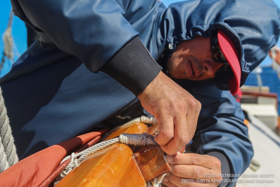 Duane taking off sail ties to change out the sail.