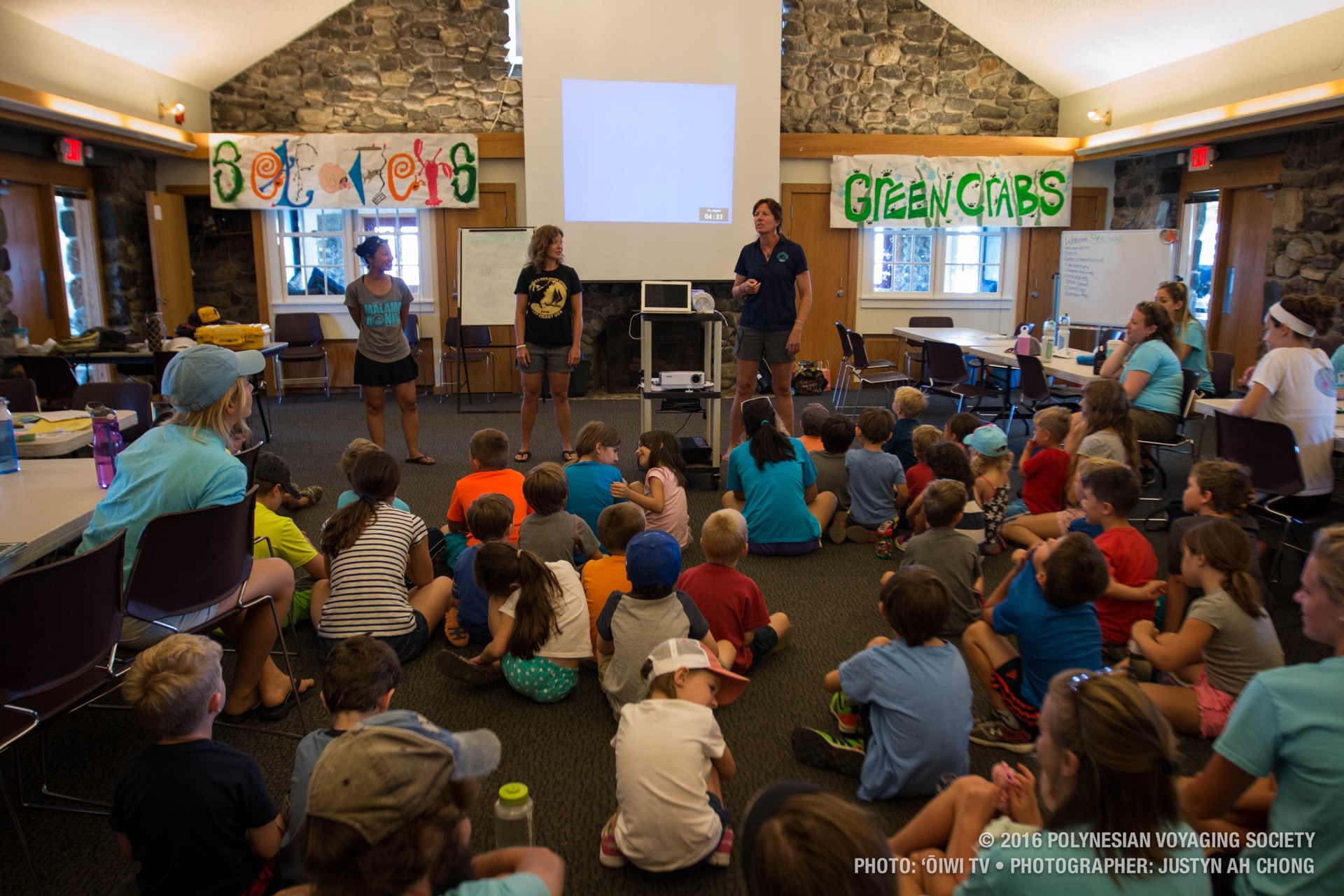 Crewmembers Megan Kawatachi, Shelly Knoetgen, and Catherine Fuller give a presentation to the students of the Seacoast Science Center in Portsmouth, New Hampshire.