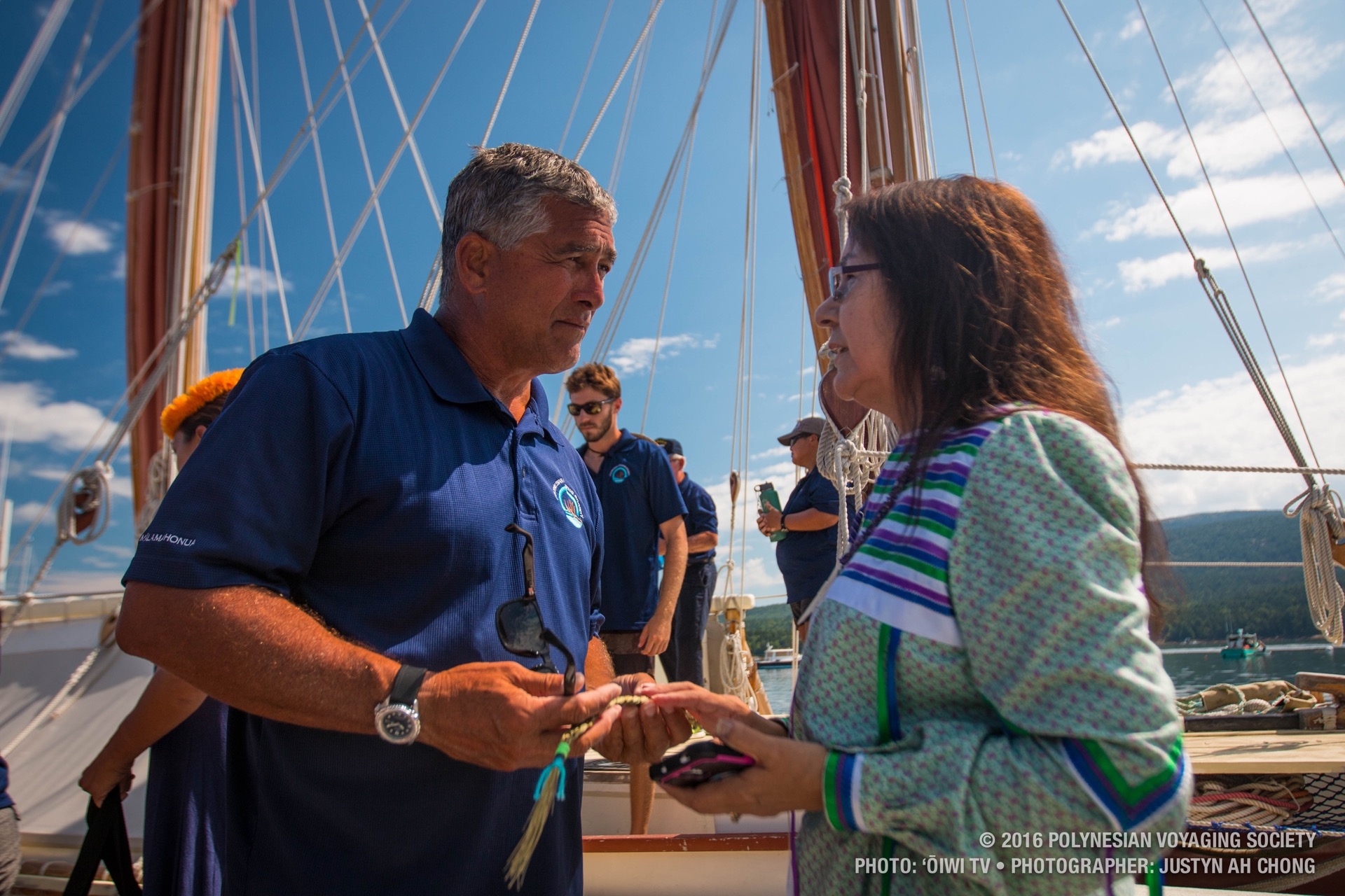 A gift of sweet grass is shared with our captain.