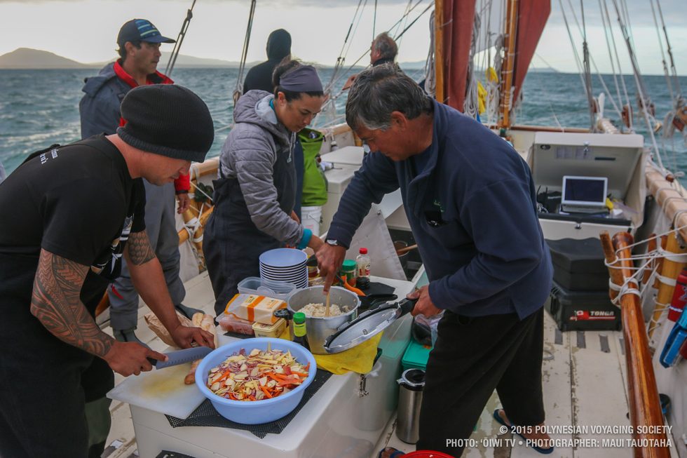 Kai, Ana and Captain Bruce making dinner of beef stew, rice and salad.