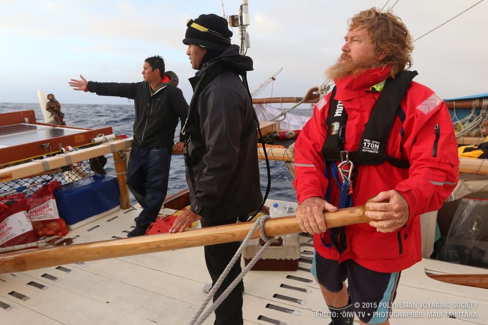 Kaleo explaining to Kawika and Craig our course in relation to the sunrise.