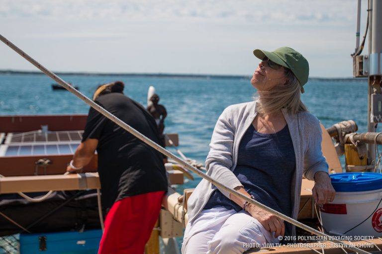 Sam’s partner, Nan, enjoys the view as sails go up on board Hōkūleʻa