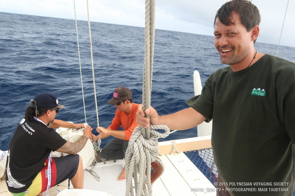 Matahi mugging for the cam while Kaleo and Kai hank on the jib.